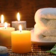 candles next to folded white towels