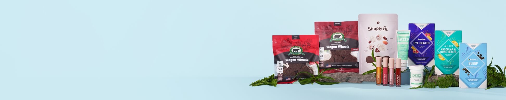 A variety of health products are displayed against a light blue background, including nutritional supplements, snacks, and cosmetics, arranged neatly with greenery.