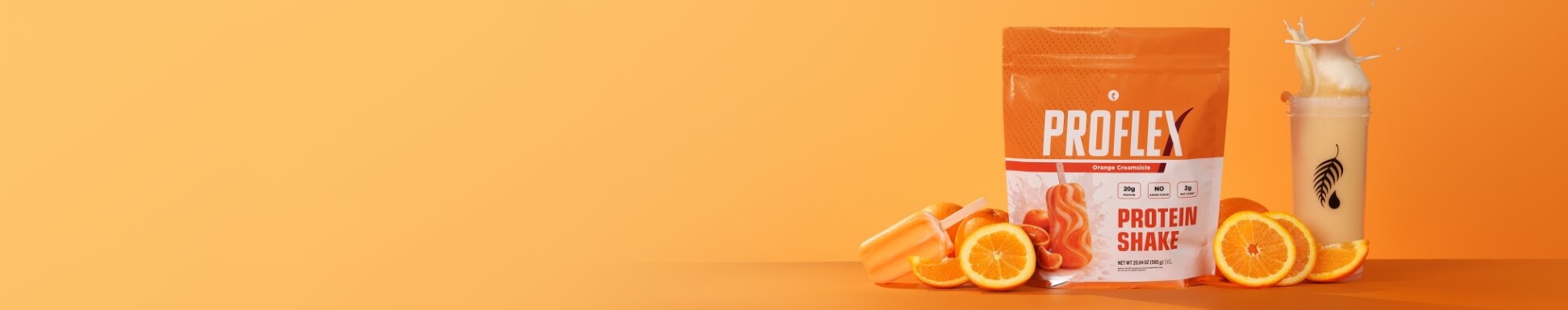 Creamsicle Proflex surrounded by oranges on a orange backdrop