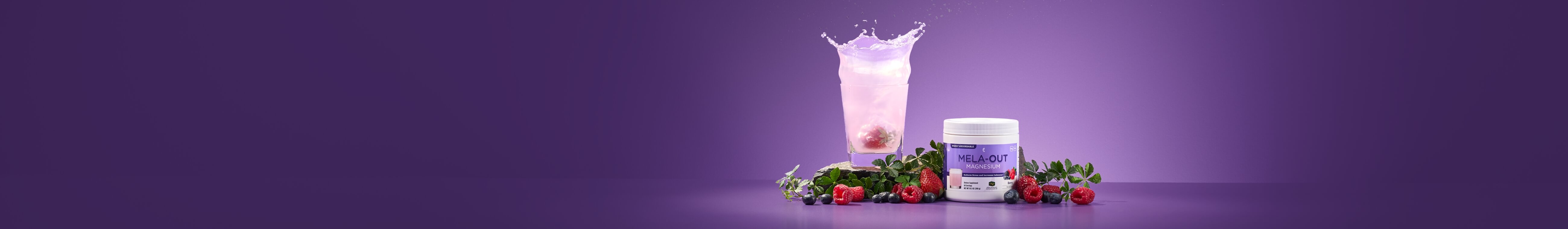A jar of Mela-Out Magnesium supplement with berries and a glass of pink liquid on a purple surface. Fresh fruits and leaves surround the products.