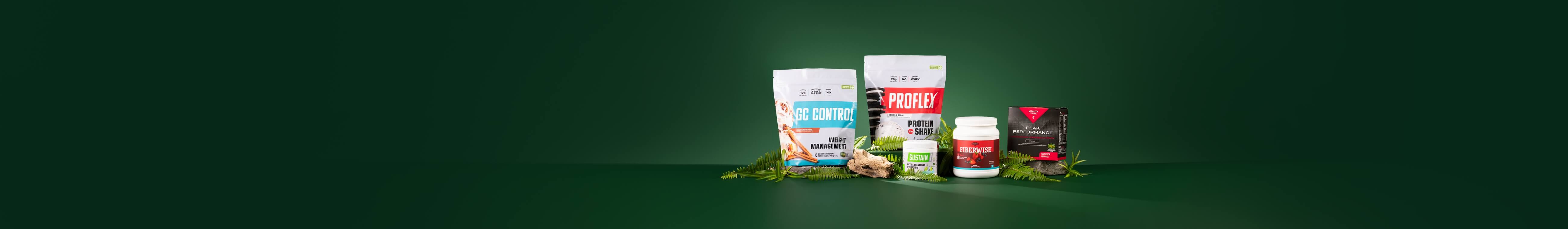 A selection of items from the Core R3 Reset plus Peak Nutrition Bundle, surrounded by green leaves.