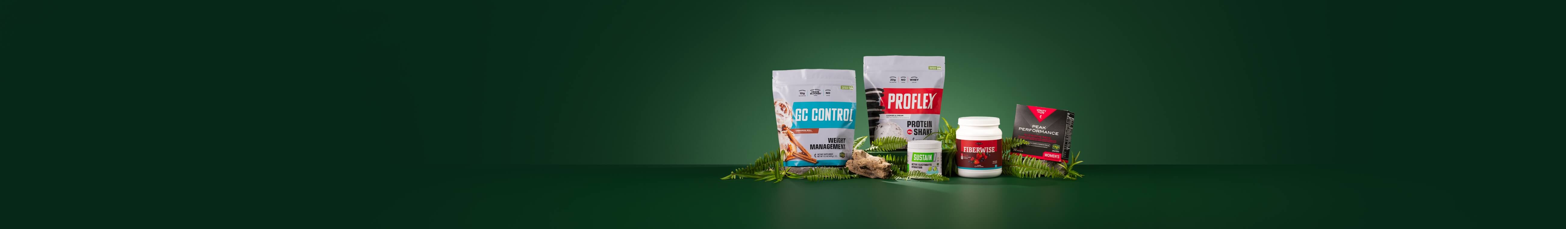 A selection of items from the Core R3 Reset plus Peak Nutrition Bundle, surrounded by green leaves.